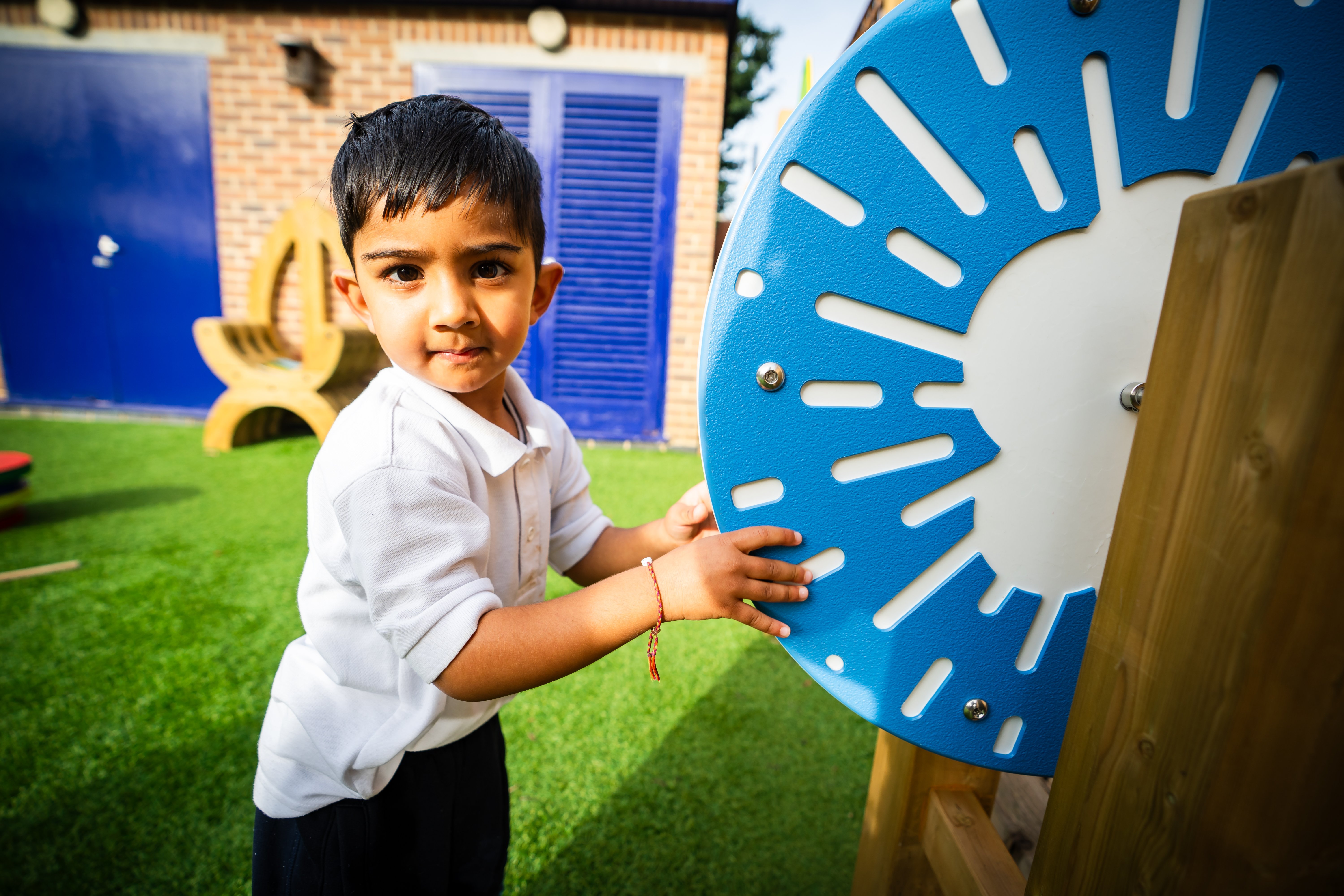 A young male St Martin's pupil in the school playground